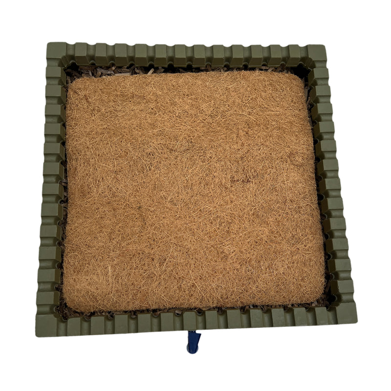 This image is of one stacking tray with a coir pad on top of the bedding, worms, and food waste.